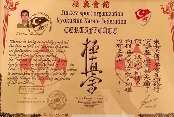The awarded Kyokushin Karate 5th Dan certificate photographed in its frame